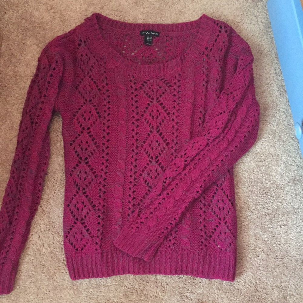 Purple/maroon sweater. Scoop/crew neck.